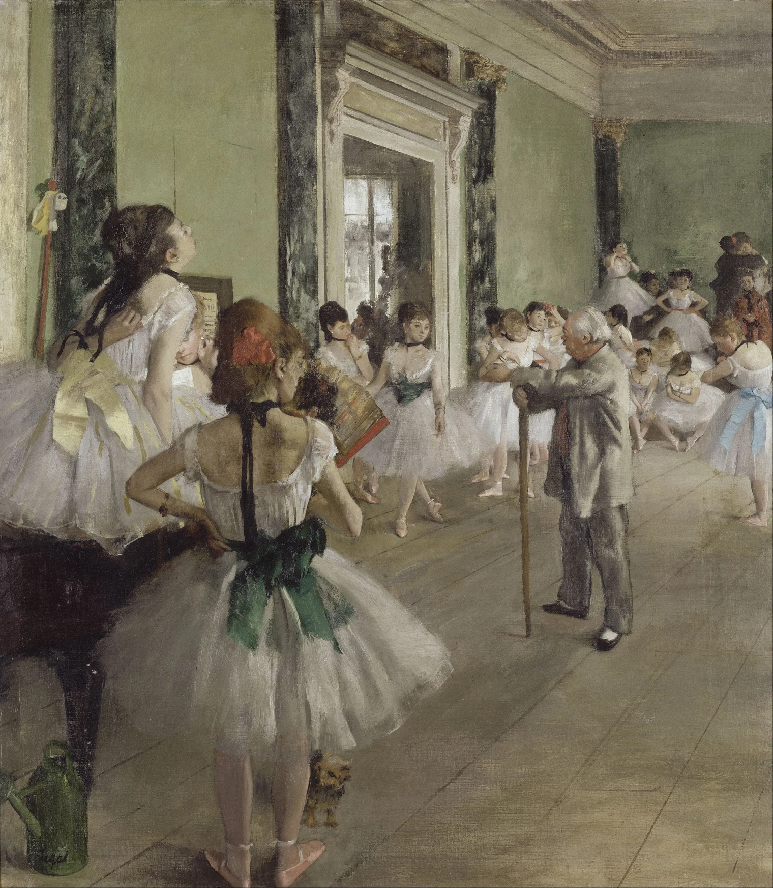 Ballet pupils rest and adjust their clothes around a standing instructor in a sunlit studio.